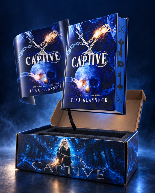 A boxed book presentation for 'Captive' by Tina Glasneck, featuring two copies of the book standing upright in front of an open cardboard box. The book cover is predominantly dark blue with glowing orange embers, a skull, and chain imagery, while the box front displays the title and a character illustration.