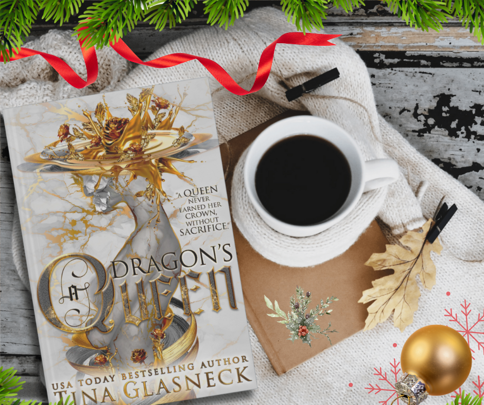 Book titled 'A Dragon's Queen' by Tina Glasneck with a cup of coffee and festive decorations on a wooden surface.